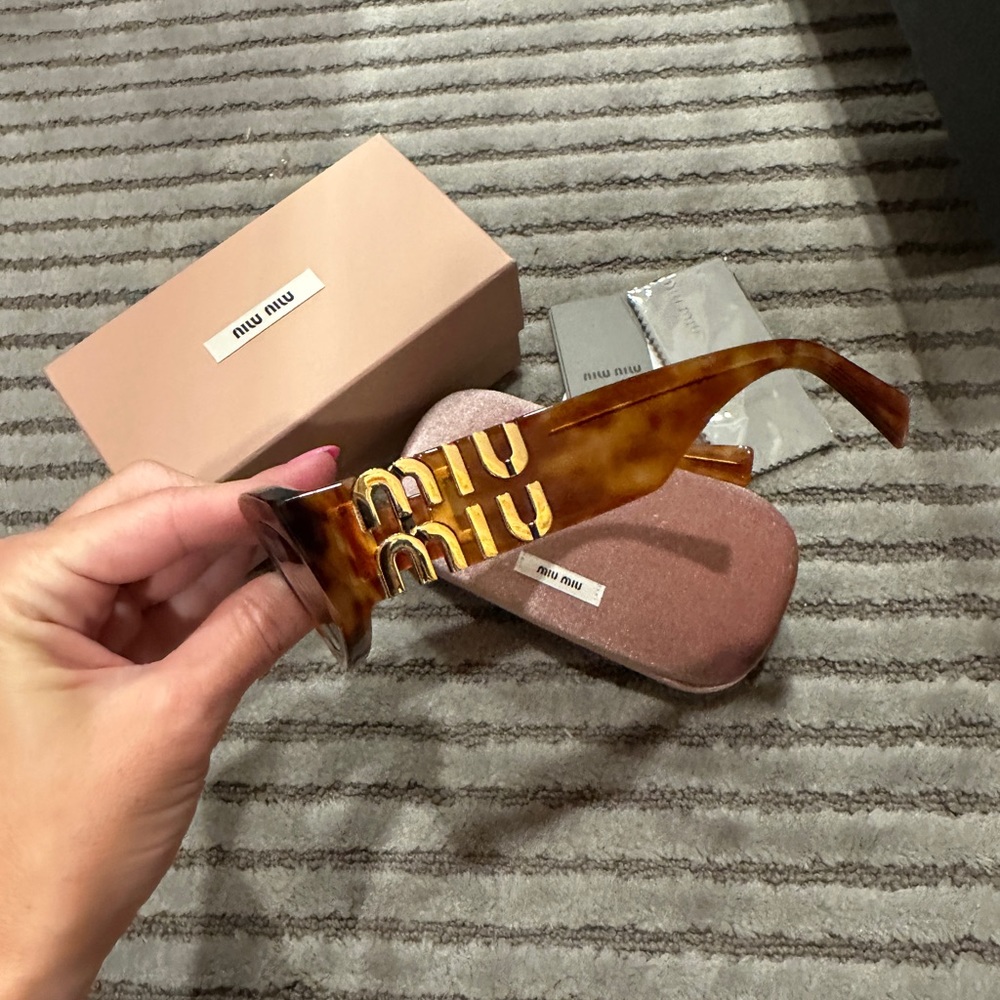 MIUMIU Oval sunglasses in brown